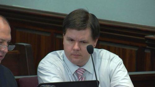 Justin Ross Harris studies a laptop during his murder trial at the Glynn County Courthouse in Brunswick, Ga., on Wednesday, Oct. 19, 2016. (screen capture via WSB-TV)