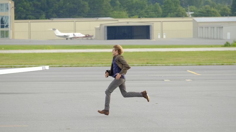 "The Rising" -- Angus "Mac" MacGyver (Lucas Till) chasing after a plane at Cobb County International Airport (pretending to be a SF private plane airport) on the series premiere of the new drama MACGYVER, Friday, Sept. 23 (8:00-9:00 PM, ET/PT), on the CBS Television Network. Lucas Till, George Eads, Sandrine Holt, Justin Hires and Tristin Mays star. Pictured: Lucas Till Photo: Guy D'Alema/CBS ÃÂ©2016 CBS Broadcasting, Inc. All Rights Reserved