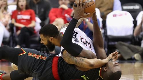 Markieff Morris of the Washington Wizards and Paul Millsap of the Atlanta Hawks go after a loose ball in the first half in Game One of the Eastern Conference Quarterfinals during the 2017 NBA Playoffs at Verizon Center on April 16, 2017 in Washington, DC. A jump ball was called on the play. (Photo by Rob Carr/Getty Images)