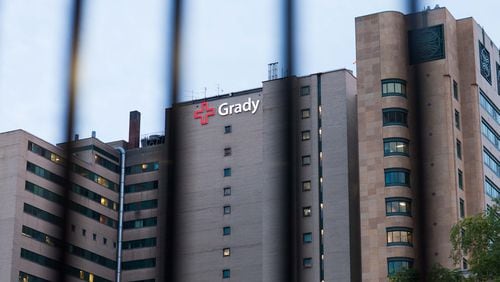 Grady Memorial Hospital, seen through metal bars of a fence, stands in downtown Atlanta, Monday, June 1, 2015. Grady Memorial Hospital has at least 1,300 rape kits sitting in file cabinets, untested, for DNA evidence that could be used to track down rapists. BRANDEN CAMP/SPECIAL