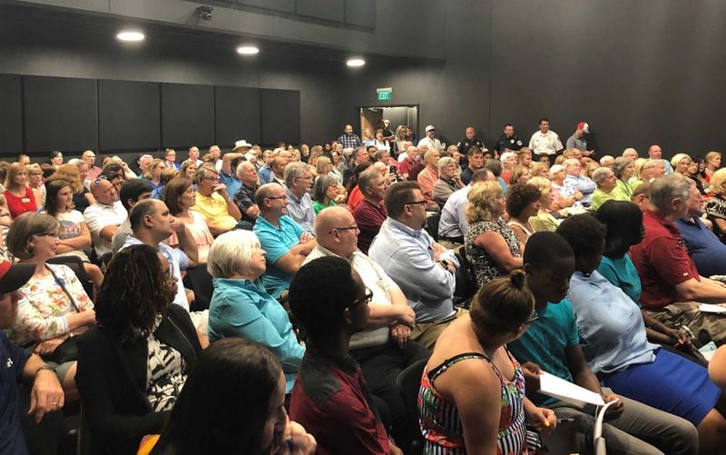 Hundreds of residents packed the Sewell Mill Library Monday night for Cobb Chairman Mike Boyce's final tax town hall. (Christina Maxouris/AJC)