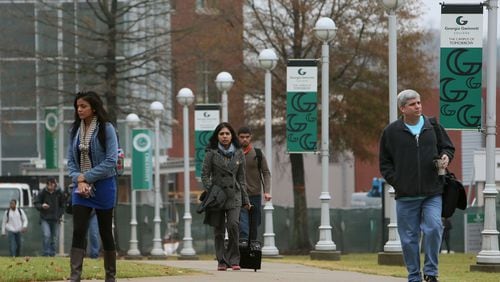 Students and others walk on the Georgia Gwinnett College campus in Lawrenceville on Dec. 3, 2013. BOB ANDRES / BANDRES@AJC.COM