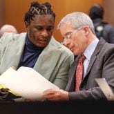 Atlanta rapper Young Thug speaks with defense attorney Brian Steel during his ongoing gang and racketeering trial at Fulton County Courthouse on Tuesday, Jan. 2, 2024. (Natrice Miller/ Natrice.miller@ajc.com)