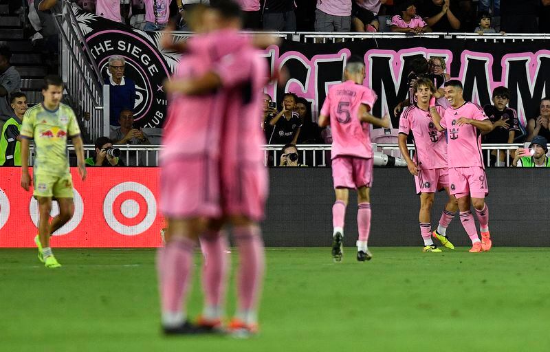 Inter Miami players celebrate after a goal against the New York Red Bulls during the second half of an MLS soccer game, Saturday, May 4, 2024, in Fort Lauderdale, Fla. (AP Photo/Michael Laughlin)