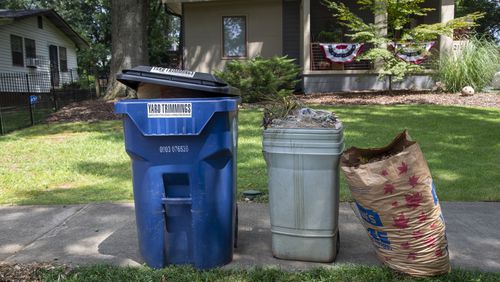 Curbside trash and recycling customers across metro Atlanta will see one- to two-day delays this week. (Alyssa Pointer/Atlanta Journal Constitution)