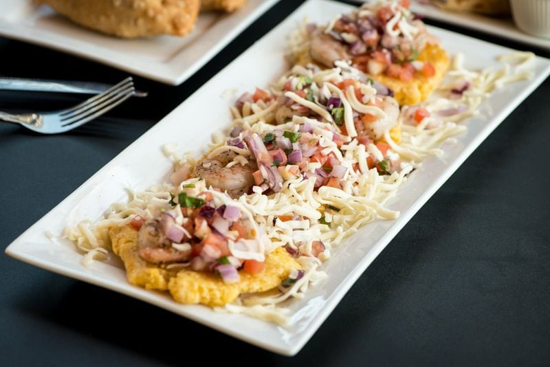  Papi's tostones supremos: fried green plantains, shredded mozzarella, pico de gallo, and shrimp. CONTRIBUTED BY MIA YAKEL