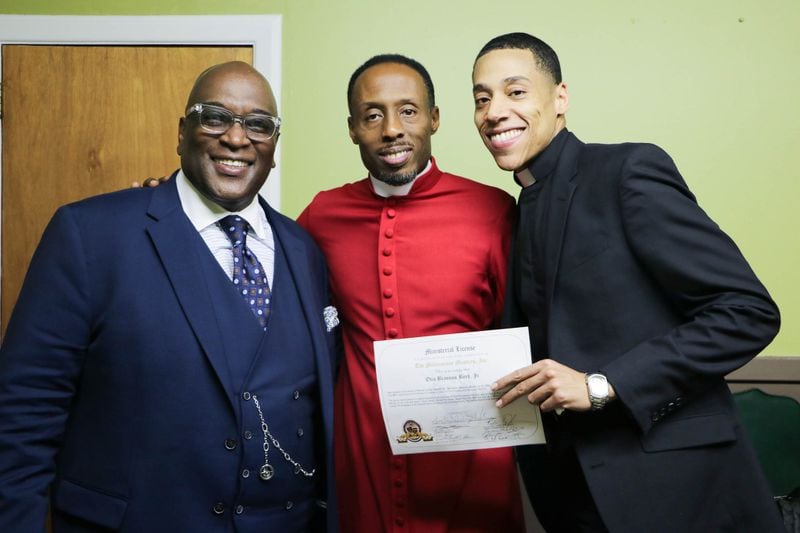 Bishop Stephen B. Hall, left, and Apostle B. Dwayne Hardin congratulate Minister Otis Byrd Jr. after he preached his trial sermon in June. CONTRIBUTED BY SHANTA KING 