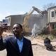Atlanta Mayor Andre Dickens shoots a video as  demolition work begins on the former Forest Cove Apartments on Wednesday, March 20, 2024.   (Ben Gray / Ben@BenGray.com)