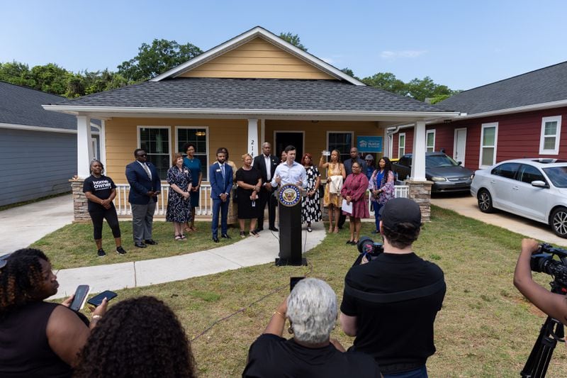 U.S. Sen. Jon Ossoff, D-Ga, announces federal funds for housing in Clayton County at press conference in Lovejoy on Monday, May 6, 2024. The conference took place in front of a house built by Southern Crescent Habitat for Humanity. (Arvin Temkar / AJC)