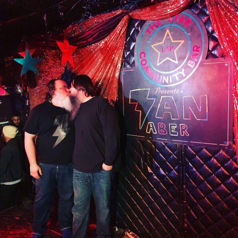 Ian Aber and husband Payne Broome kiss for luck on the night of Aber's album recording at Star Bar in 2019.