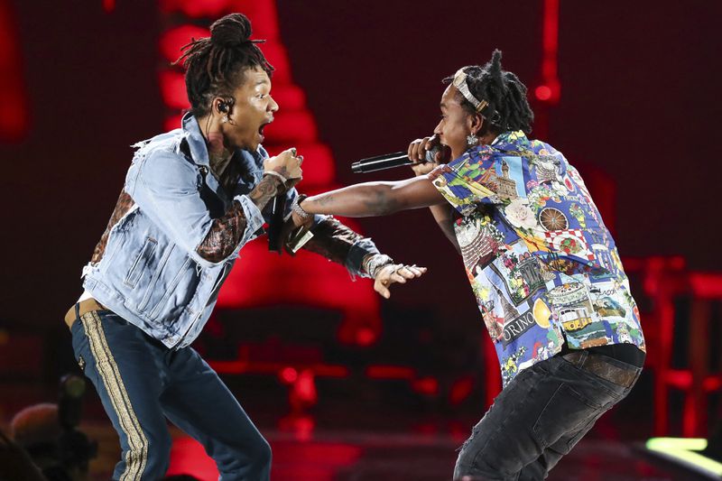 Swae Lee, left, and Slim Jxmmi of the group Rae Sremmurd perform at the 2018 iHeartRadio Music Festival Day 1 held at T-Mobile Arena on Friday, Sept. 21, 2018, in Las Vegas. (Photo by John Salangsang/Invision/AP)