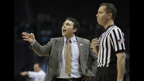 <p> Georgia Tech head coach Josh Pastner, left, directs his team against Notre Dame during the first half of an NCAA college basketball game in the Atlantic Coast Conference tournament in Charlotte, N.C., Tuesday, March 12, 2019. (AP Photo/Nell Redmond) </p>