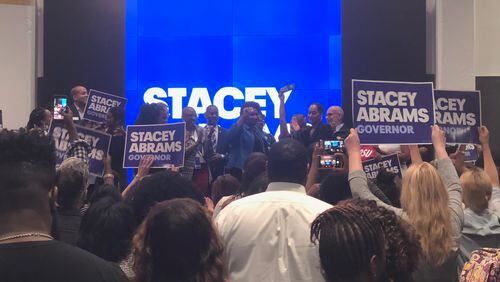 Stacey Abrams appears with a quartet of TV stars as early voting begins. AJC photo.