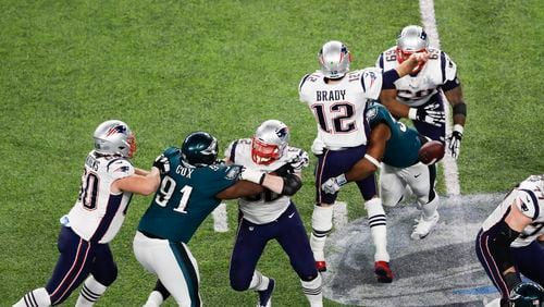 New England quarterback Tom Brady fumbles in the fourth quarter after being hit by Philadelphia’s Brandon Graham at U.S. Bank Stadium in Minneapolis. The fumble led to a field goal and a clinching field goal in the Eagles’ win.