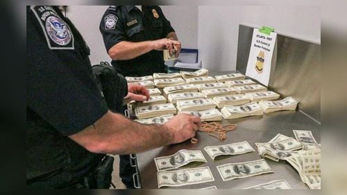 Federal authorities arrested a 62-year-old man accused of smuggling more than $500,000 in counterfeit money.