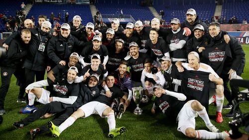 The Atlanta United FC pose with the conference trophy after the Eastern Conference Finals Leg 2 match against the New York Red Bulls at Red Bull Arena on November 29, 2018 in Harrison, New Jersey. (Photo by Elsa/Getty Images)