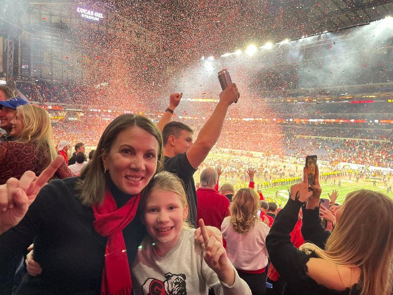 State Rep. Stacey Evans and her daughter celebrate Georgia's championship win in Indianapolis.