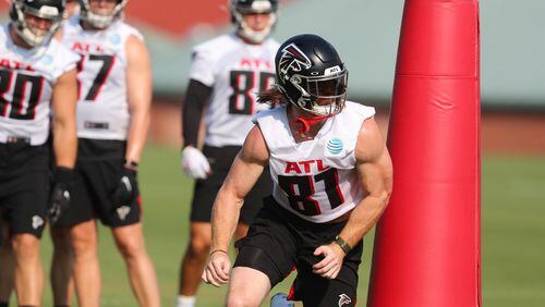 Falcons tight end Hayden Hurst runs a drill the first day of practice during training camp Thursday, July 29, 2021, at the team's training facility in Flowery Branch. (Curtis Compton / Curtis.Compton@ajc.com)