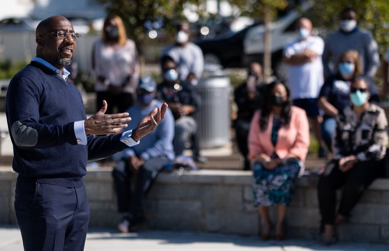 Rev. Raphael Warnock, who is running for Senate, talks to supporters during a Democratic gathering in Powder Springs on Saturday. Ben Gray for the Atlanta Journal-Constitution