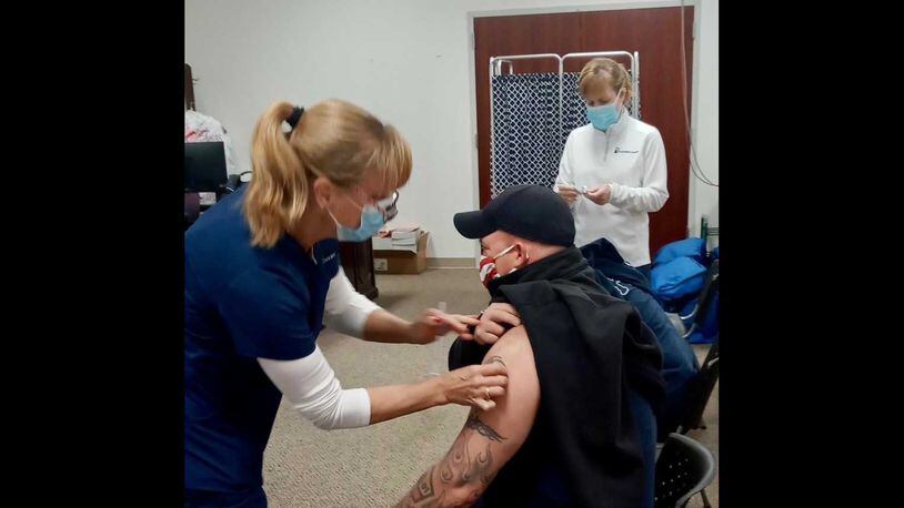 Savannah Fire Department Capt. Kevan Carter receives a COVID-19 vaccination shot on Monday, Dec. 21, 2020. He was one of 34 department workers to get vaccinated. PHOTO CREDIT: Savannah Fire Department.