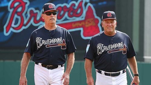 Brian Snitker (left, with Dave Trembley during spring training) is beginning his second full season as the manager of the Braves. (Curtis Compton/ccompton@ajc.com)