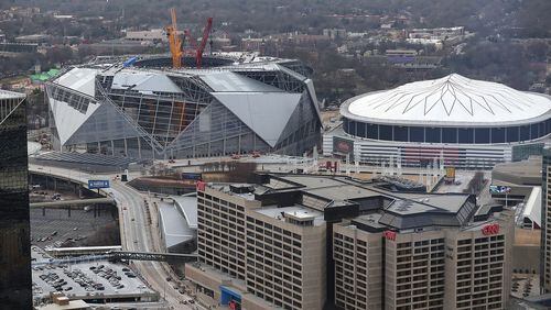 Construction continues on Mercedes-Benz Stadium, next door to the Georgia Dome. (Curtis Compton/ccompton@ajc.com)