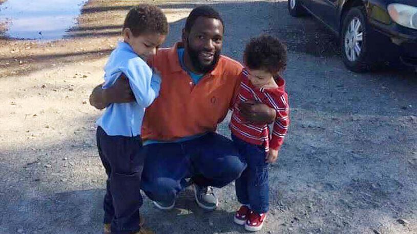 In this 2015 family photo, Antonio May poses with his sons Za'Kobe and Jordan Rickerson. In September 2018, May was pronounced dead after being repeatedly shocked with a Taser in the Fulton County jail. On Nov. 16, 2021, six deputy sheriffs were indicted on five counts, including felony murder, for their alleged treatment of May. Photo courtesy of May attorney Michael Harper.