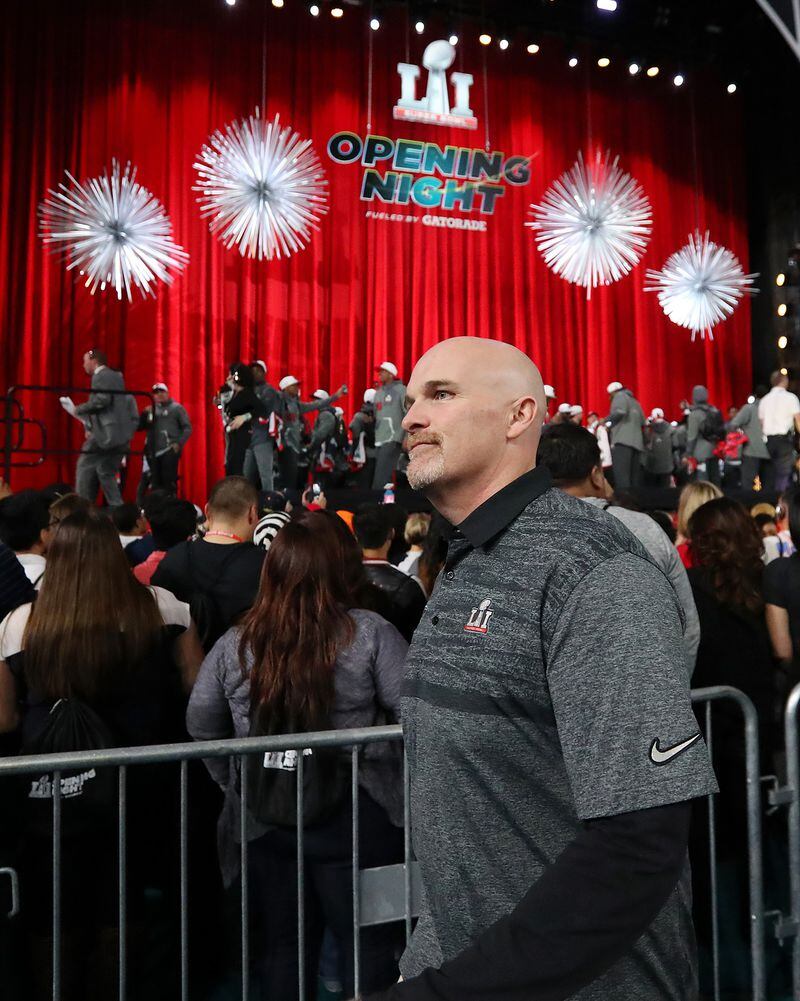  January 30, 2017, Houston: Falcons head coach Dan Quinn heads to his seat to answer questions on Super Bowl Opening Night on Monday, Jan. 30, 2017, at Minute Maid Park in Houston. Curtis Compton/ccompton@ajc.com
