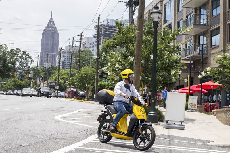 The Atlanta Journal-Constitution’s Matt Kempner takes a Muving scooter for a ride on Piedmont Avenue in Atlanta. A variety of electric devices are now available to rent on-demand for short intown trips. ALYSSA POINTER/ALYSSA.POINTER@AJC.COM