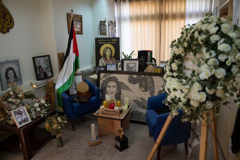 The office of late Al Jazeera network journalist Shireen Abu Akleh is decorated with memorial items, inside the network's office, in the West Bank city of Ramallah Sunday, May 5, 2024. Israel ordered the local offices of Qatar's Al Jazeera satellite news network to close Sunday, escalating a long-running feud between the broadcaster and Prime Minister Benjamin Netanyahu's hard-line government as Doha-mediated cease-fire negotiations with Hamas hang in the balance. (AP Photo/Nasser Nasser)