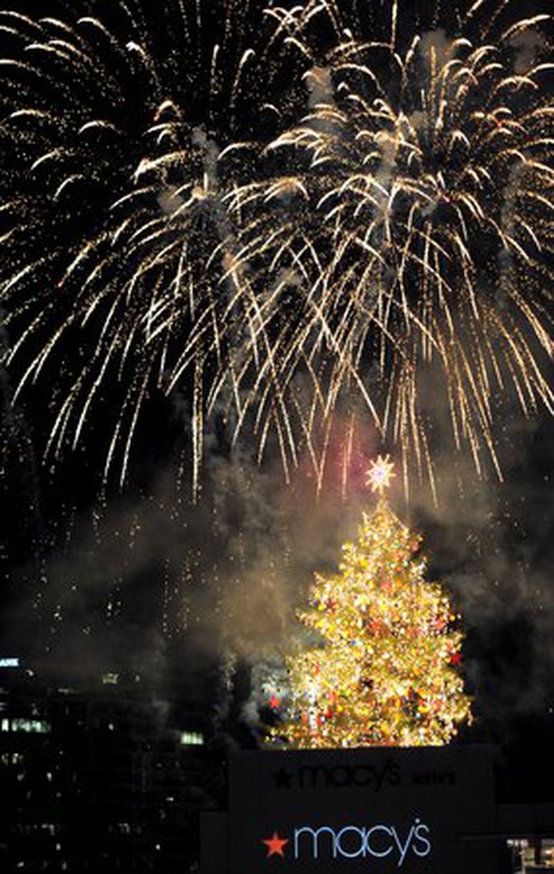 Fireworks go off after the Macy's Great Tree Lighting at Lenox Square Mall on Thursday, November 24, 2011. Te tradition, now in its 64th year, was begun by the Rich's store. This year's tree is a 70-foot white pine that weighs approximately 12,000 pounds and is estimated to be 45 years old. Its decor package includes 100 Macy's stars and 100 white snowflakes along with 1,200 multi-colored metallic basketball-sized ornaments.