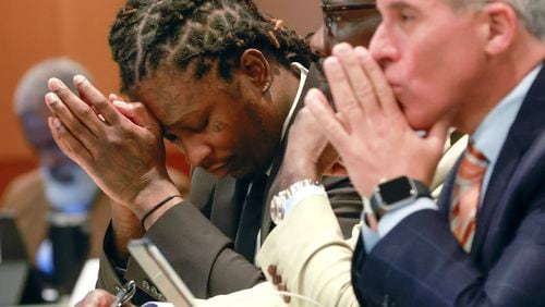 Atlanta rapper Young Thug sits next to his attorney at a recent bond hearing. Jury selection in the sprawling gang case began in January. 
File photo.
(Natrice Miller/ Natrice.miller@ajc.com)