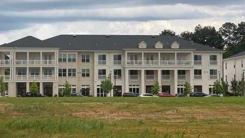 Only apartments stand on a nearly empty 18-acre property on Ga. 9 at Sun Valley Road where a developer in 2017 did not bring a grocery store, office, retail and restaurant space as planned.