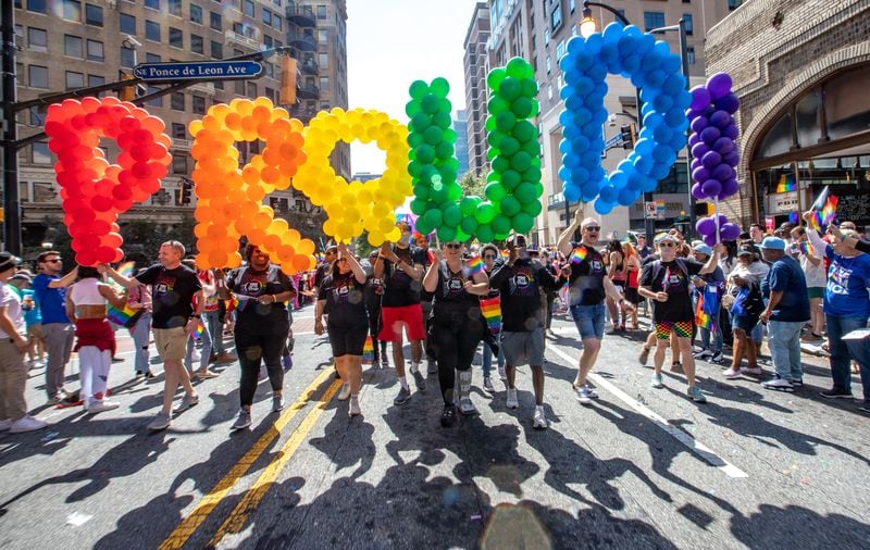 The Atlanta Pride Parade moves down Peachtree Street to 10th Street ending in Piedmont Park on Sunday, Oct. 9, 2022. (Photo: Jenni Girtman for The Atlanta Journal-Constitution)