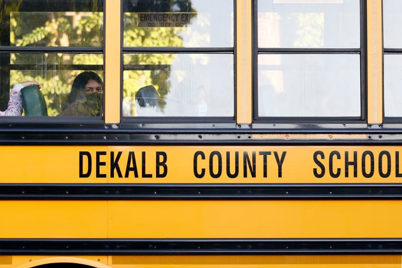 A student awaits in the bus, ready to get out during the first day of school for Dekalb County public schools at Cross Keys High School in Atlanta on Monday, August 8, 2022.  Miguel Martinez / miguel.martinezjimenez@ajc.com