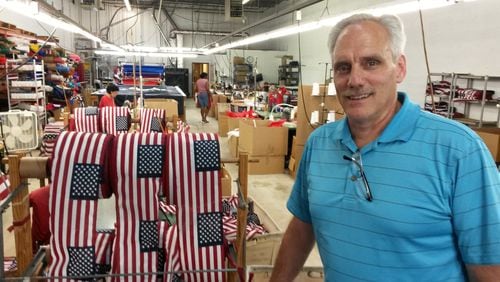 Just over a year ago, Steve Cook bought flag maker Atlas Flags in Tucker. Soon after, he quietly stopped production of Confederate battle flags, long before the shootings in Charleston. MATT KEMPNER / AJC