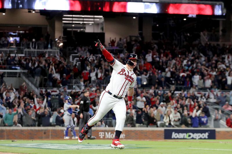 Braves rightfielder Joc Pederson reacts after hitting a two-run home run during the fourth inning of  Game 2 of the NLCS Sunday, Oct. 17, 2021, against the Los Angeles Dodgers at Truist Park in Atlanta. (Curtis Compton / curtis.compton@ajc.com)
