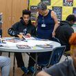 Redan High School FACE advocate Gail Jones (right) helps Christian Abram with his vision board during an end-of-year group project in Stone Mountain on Tuesday, May 14, 2024. (Steve Schaefer / AJC)