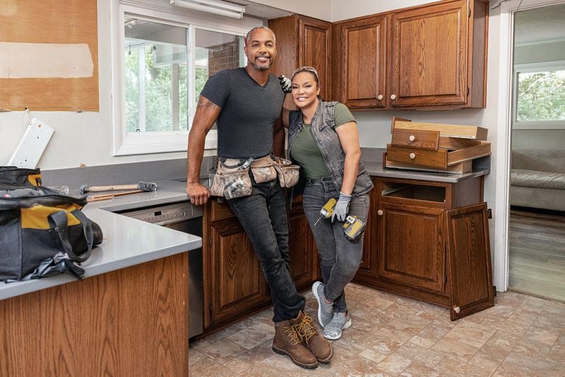 As seen on HGTV's "Married to Real Estate," hosts Egypt Sherrod, right, and Mike Jackson stand in the Cole's kitchen mid-demo. (Jessica McGowan/Getty Images/Discovery/TNS)