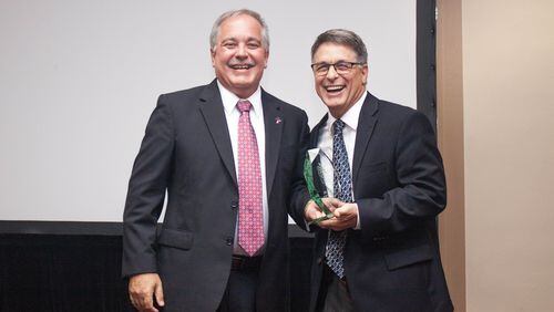 John R. Tibbetts (right), with Georgia Superintendent Richard Woods, when Tibbetts was named 2018 teacher of the year.