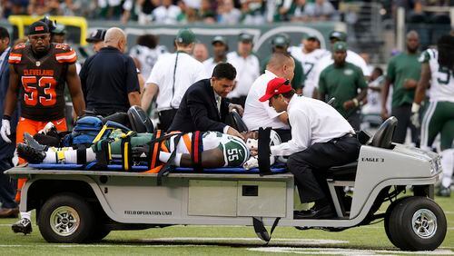 New York Jets outside linebacker Lorenzo Mauldin (55) is carted off the field during the second half of an NFL football game against the Cleveland Browns Sunday, Sept. 13, 2015 in East Rutherford, N.J. The Jets won 31-10. (AP Photo/Kathy Willens)
