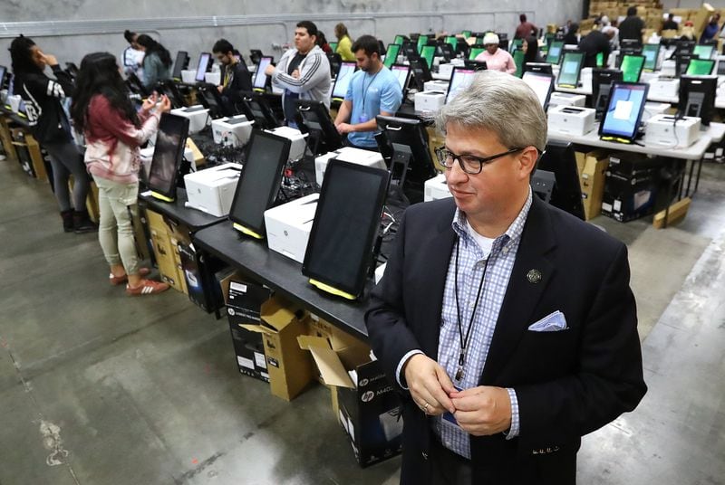 Implementation Manager Gabriel Sterling discusses the state’s new voting machines Tuesday while they are tested and packed in an Atlanta-area warehouse. Curtis Compton ccompton@ajc.com