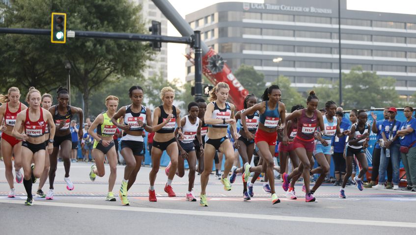 Elite woman runners take off at the start of the 53rd running of the Atlanta Journal-Constitution Peachtree Road Race in Atlanta on Monday, July 4, 2022. (Miguel Martinez / Miguel.MartinezJimenez@ajc.com)