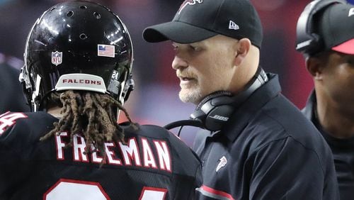 Falcons running back Devonta Freeman gets a pat on the back from head coach Dan Quinn after his second of three touchdown runs during the second quarter of Sunday's 41-13 win over San Francisco at the Georgia Dome. Freeman rushed for 139 yards. (Curtis Compton/ccompton@ajc.com)