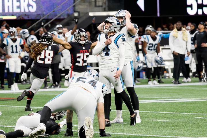 Panthers kicker Eddy Piñeiro (4) reacts after missing a field goal in overtime Sunday against the host Falcons. Atlanta won 37-34. (Miguel Martinez / miguel.martinezjimenez@ajc.com)