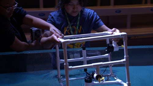 STEAM students from Gwinnett County's Sweetwater Middle School work on underwater remote-operated vehicles as part of a spring break program at the Georgia Aquarium. (Courtesy of Georgia Aquarium)