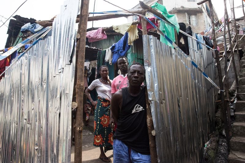 The following photo is in the Ebola exhibit: A quarantined family in Freetown, Sierra Leone, during Operation Western Surge, Dec. 17, 2014. CONTRIBUTED BY MARTINE PERRET, COURTESY OF UNMEER