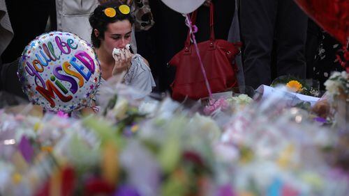 A woman pays tribute to those killed outside an Ariana Grande concert Monday night in Manchester, England. (Photo by Christopher Furlong/Getty Images)