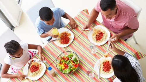 Sitting down for a meal together lowered their family’s stress level, according to 91% of parents who responded to a nationwide survey by the American Heart Association. (Dreamstime/TNS)
