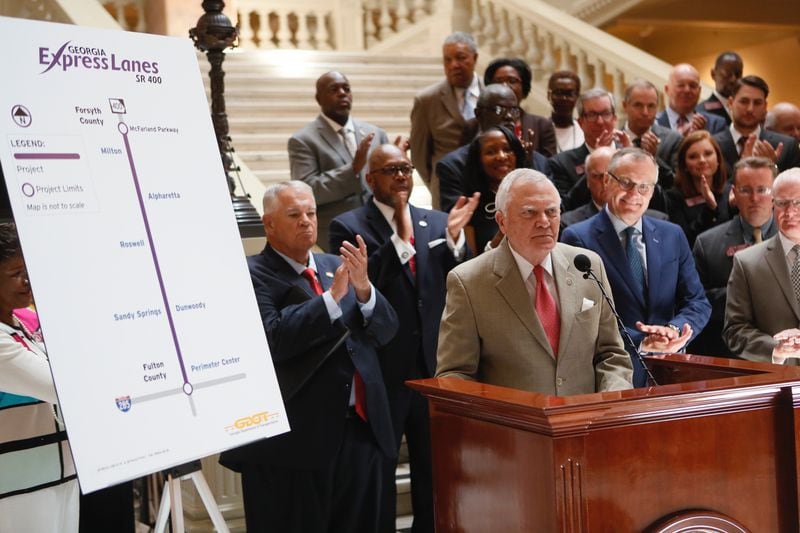 Gov. Nathan Deal and other state leaders on Tuesday announced they’ll spend $100 million on four new interchanges for commuter buses on Ga. 400. BOB ANDRES/BANDRES@AJC.COM